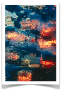 Image of hillside homes burning