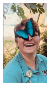 Chelsea with a blue butterfly on her nose