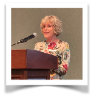 Jane Leary at the podium